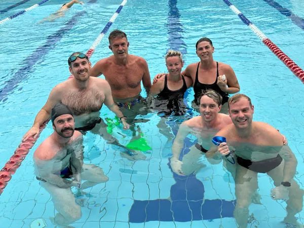 Club members together in the pool after a training session